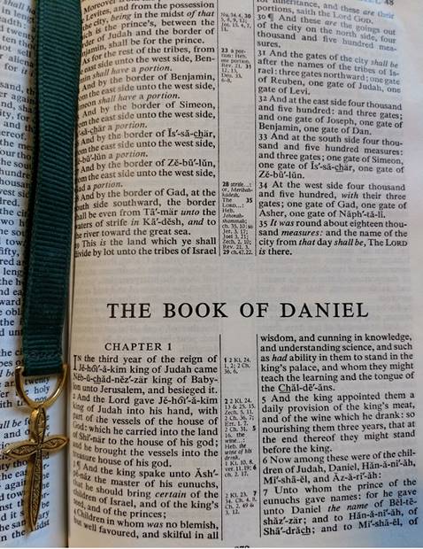 Image of a Bible opened to main page of Daniel