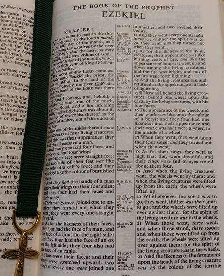 Image of a Bible opened to the main page of the Book of Ezekiel