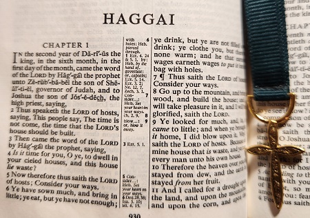 Picture of a Bible opened to the Book of Haggai.